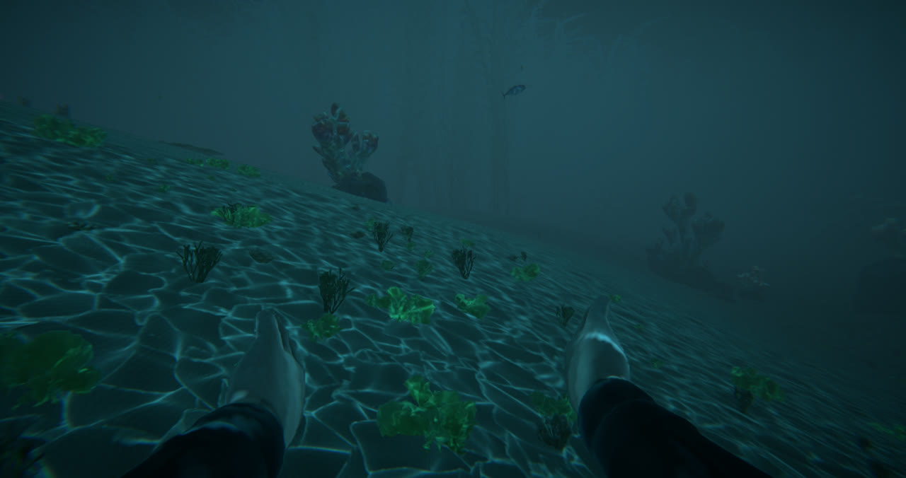 A diver's feet above a caustic-lit sandy slope, corals fading into the blue